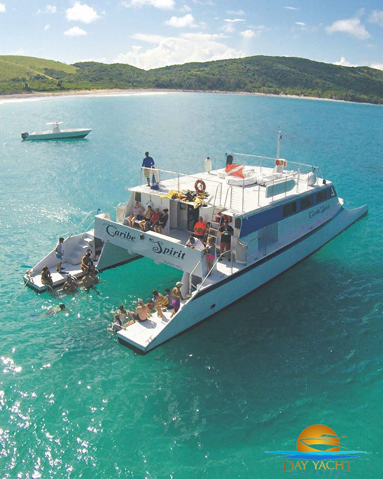 Guests swimming off the yacht swim platform, private yacht charter Puerto Rico